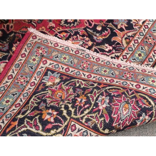 264 - Persian Handwoven Red Ground Carpet of Traditional Medallion Pattern Design (343cm x 245cm)