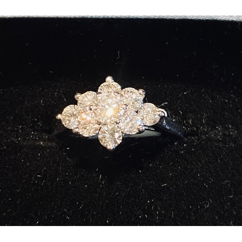 302 - 18 Carat White Gold 9 Stone Diamond Cluster Ring. Diamonds approx 1.50carats.  Colour F. Clarity VS2... 