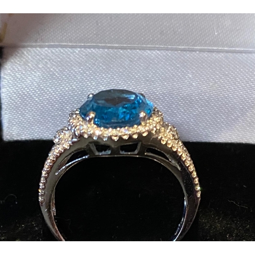 420 - 18 Carat White Gold Blue Topaz approx 5 carats and Diamond Cluster Ring.  Diamond eight approx. 1 ca... 