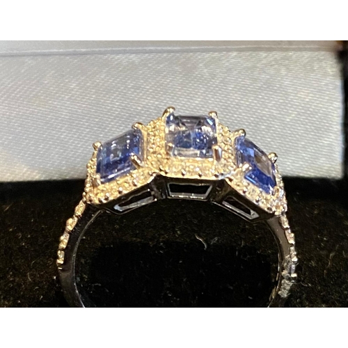 421 - 18 Carat White Gold 3 Stone Emerald Cut Sapphire & Diamond Ring.  Ring Size )