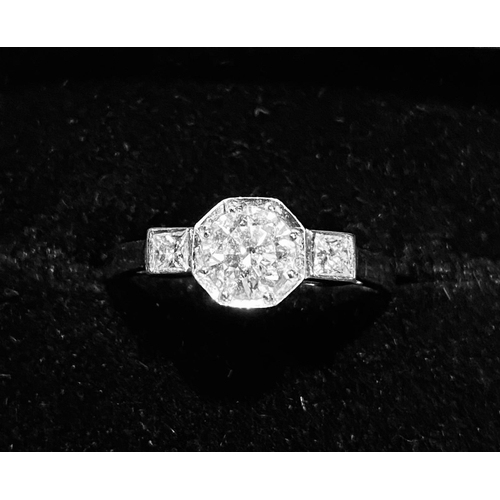 429 - Platinum Diamond Solitaire Ring.  Centre Diamond 1 carat approx with two princess cut diamonds on th... 