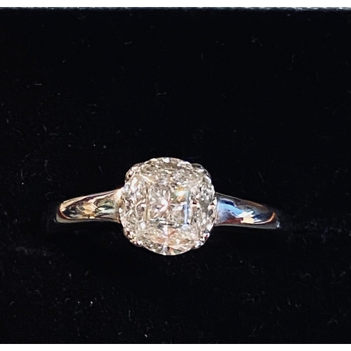 557 - 18 carat White Gold Diamond Cluster Ring.  Approx .90 carats.  Colour G, Clarity VS2.  Ring Size M