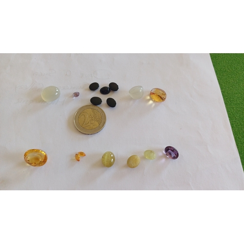 561 - Collection of various precious stones including Citrine, Pink Sapphire, Amethyst, Moonstone, Black O... 