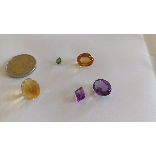 568 - Collection of precious Stones including Emerald, Citrine, Garnet and Amethyst