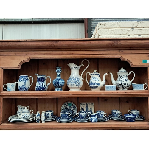 11 - Two Shelves of Blue and White Porcelain including Vases, Jugs, Tea Pots and a Tea Set