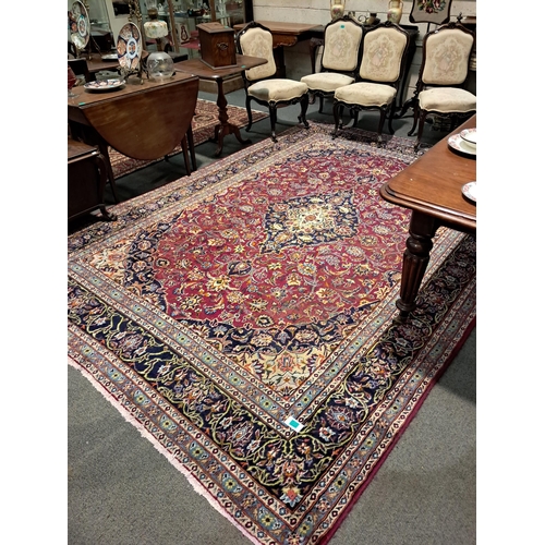 202 - Persian Handwoven Red Ground Carpet of Traditional Medallion Pattern Design (343cm x 245cm)