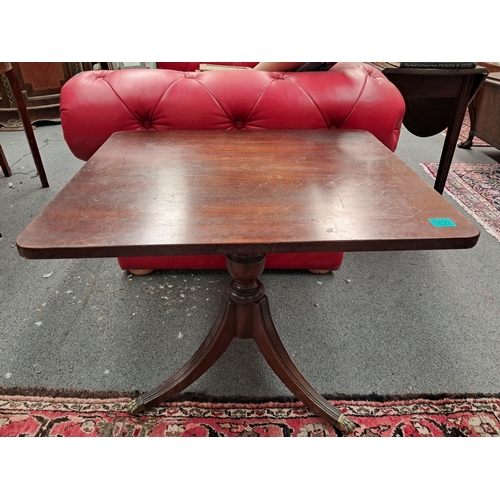 292 - Early Victorian Mahogany Occasional Table on turned columns with 3 reeded legs on brass castors