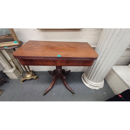 686 - Early 19th Century Mahogany Tea Table on turned column with 4 splay legs on brass castors