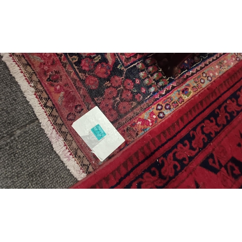 716 - Persian Handwoven Red Ground Carpet (some wear) - 286cm x 200cm