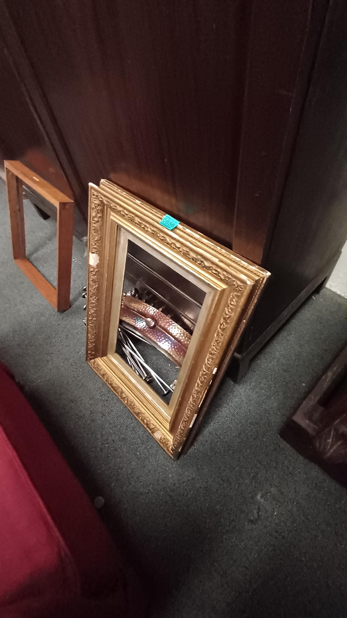 Gilt Frame, a Fire Front and some metal rods