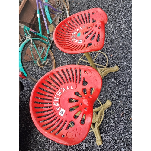 99 - Pair of Revolving Cast Iron Tall Tractor Seat Stools