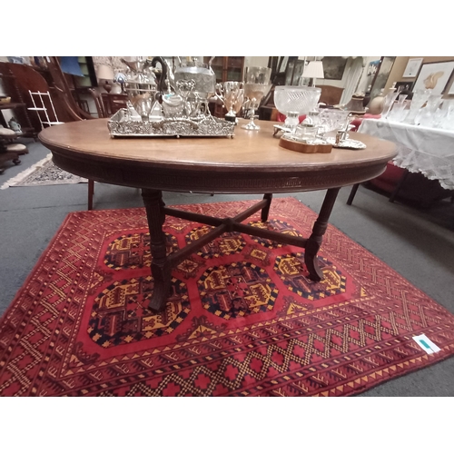 256 - Victorian Mahogany Oval Centre Table on 4 reeded legs with stretcher base