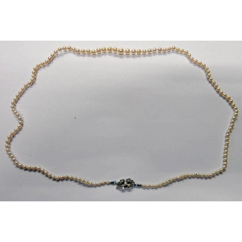 14 - CULTURED PEARL NECKLACE ON DIAMOND & PEARL SET CLASP MARKED 9CT