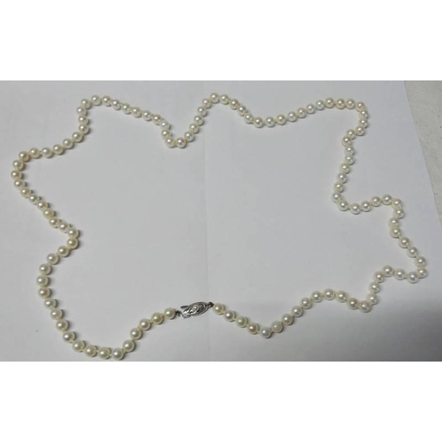 218 - LONG STRING OF CULTURED PEARLS ON PEARL SET CLASP MARKED SILVER, LENGTH 96CM