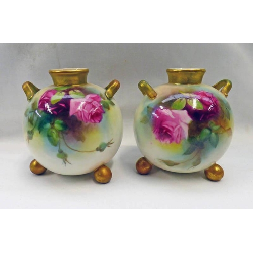 3412 - PAIR ROYAL WORCESTER TWIN HANDLED ROSE DECORATED VASES ON 3 BALL FEET  - 10 CM TALL