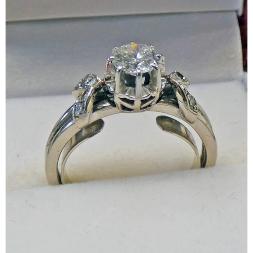 437 - 18K WHITE GOLD DIAMOND SOLITAIRE RING, THE BRILLIANT CUT DIAMOND APPROX 0.55 CARATS SET BETWEEN DIAM... 