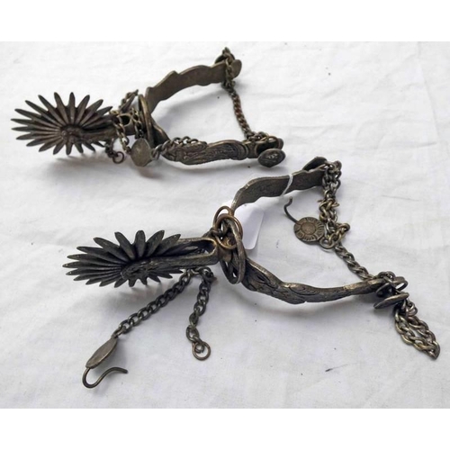 1216 - PAIR OF SOUTH AMERICAN SPURS WITH WHITE METAL BODIES DECORATED WITH SCROLLING FOLIAGE - 20.5CM LONG