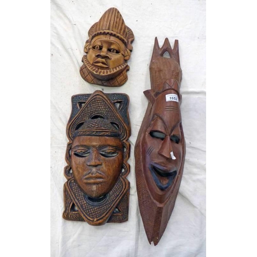 1652 - TRIBAL HARDWOOD MASK AND TWO OTHER CARVED HARDWOOD MASKS, LONGEST 66CM, -3-