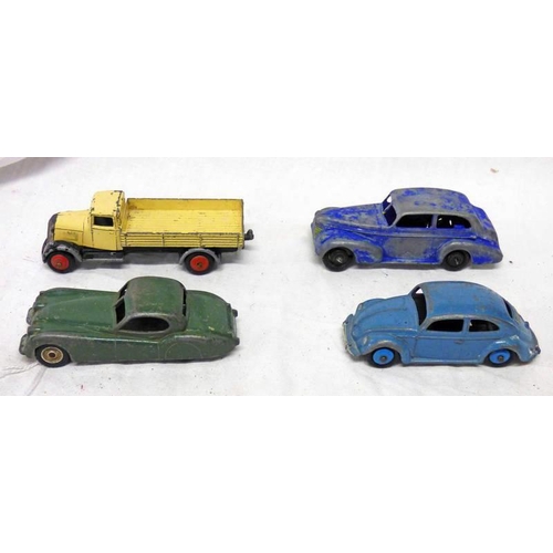 2241 - FOUR PLAYWORN DINKY TOYS INCLUDING 157 - JAGUAR, 181 - VOLKSWAGEN, 25A - WAGON AND 396 - OLDSMOBILE,