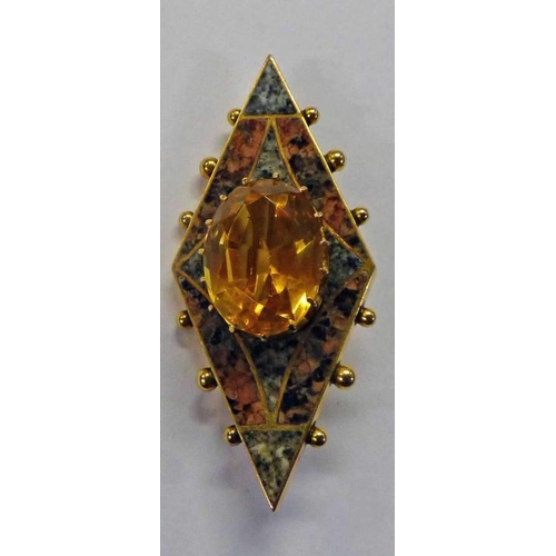 244 - SCOTTISH CITRINE AND GRANITE BROOCH WITH CENTRAL CLAW SET OVAL CUT CITRINE SURROUNDED BY RED AND GRE... 