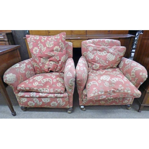 5009 - PAIR OF OVERSTUFFED ARMCHAIRS. RED WITH FLORAL PATTERN ON CASTERS   LENGTH 87 CM