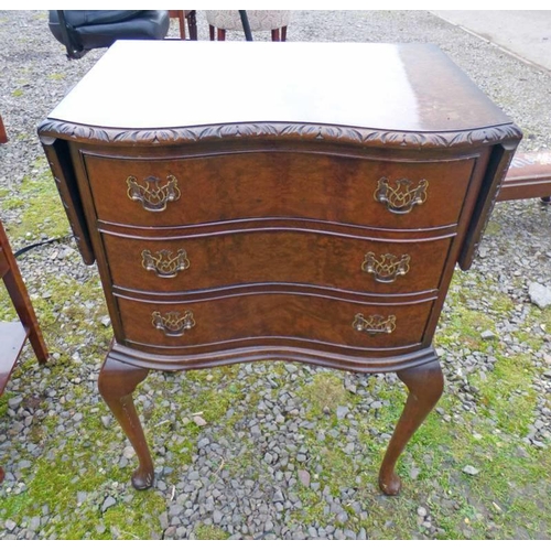 5012 - 20TH CENTURY WALNUT CHEST OF 3 DRAWERS WITH SHAPED FRONT WITH 2 LEAVES ON SHAPED SUPPORTS.  LENGTH 5... 