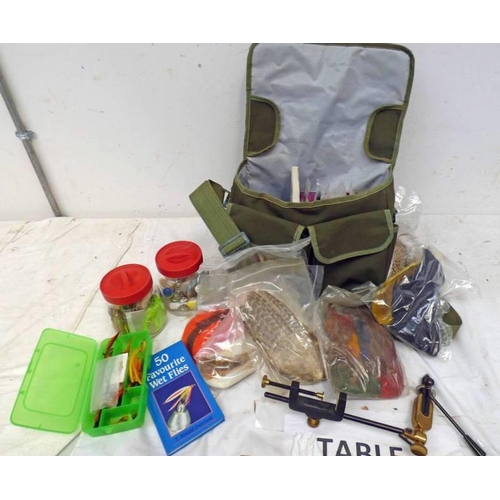 1006 - GREEN CANVAS FISHING BAG WITH CONTENTS OF FLY TYING EQUIPMENT TO INCLUDE FEATHERS, LINE, FLIES, CLAM... 