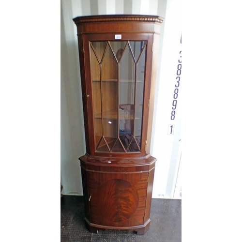 5033 - MAHOGANY CORNER CABINET WITH ASTRAGAL GLASS PANEL DOOR OVER PANEL DOOR ON BRACKET SUPPORTS, LENGTH 5... 