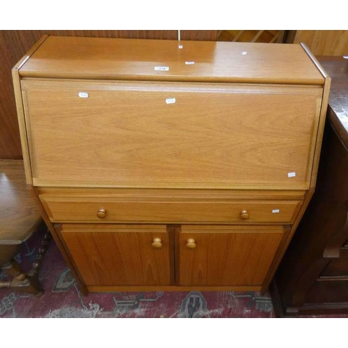 179 - 20TH CENTURY TEAK BUREAU WITH FALL FRONT OVER DRAWER & 2 PANEL DOORS