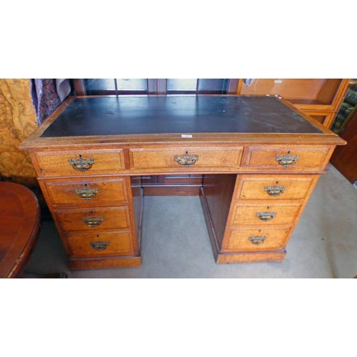 52 - OAK PEDESTAL DESK WITH BLACK LEATHER TOP, LENGTH 122CM