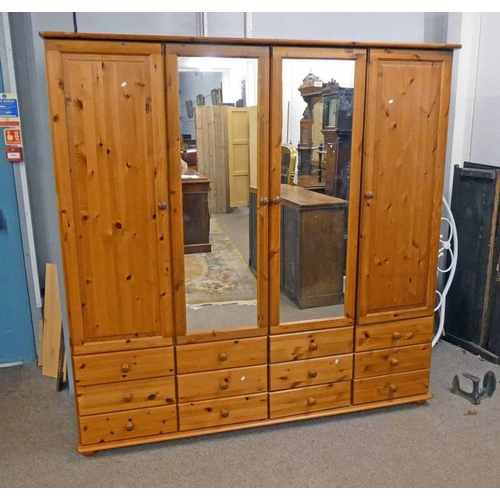 213 - LARGE PINE WARDROBE WITH 2 CENTRAL MIRROR PANEL DOORS FLANKED EACH SIDE BY PANEL DOOR OVER BASE OF 1... 