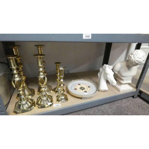 3409 - 3 PAIRS 19TH CENTURY BRASS CANDLESTICKS, PORCELAIN WALL CLOCK , BUST AND HORSE ON ONE SHELF