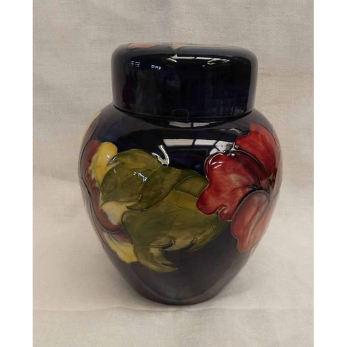 3412 - MOORCROFT LIDDED JAR WITH FLORAL DECORATION, IMPRESSED MARK AND PAPER LABEL TO BASE. HEIGHT 16 CMS