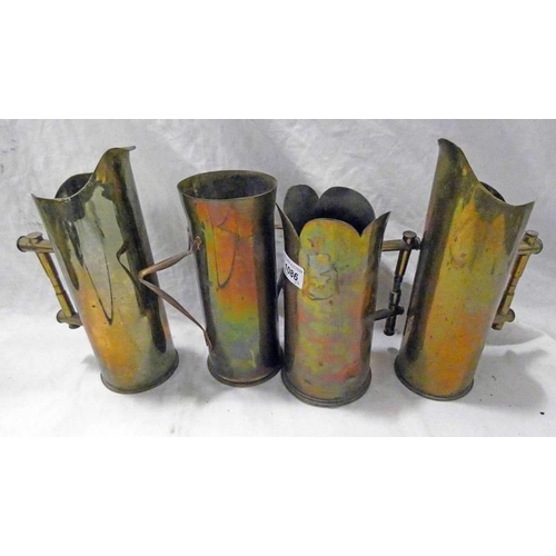 1086 - 4 WORLD WAR ONE TRENCH ART/SHELL CRAFT ARTILLERY SHELL JUGS, ONE WITH GORDON HIGHLANDERS CAP BADGE