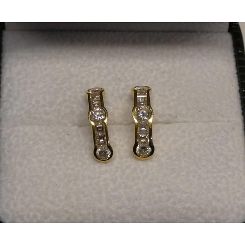 114 - 18CT GOLD DIAMOND SET EARRINGS