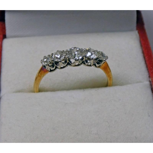 76 - DIAMOND SET 5 STONE RING IN SETTING MARKED 18CT. TOTAL CARATS, APPROX. 0.6 CARATS