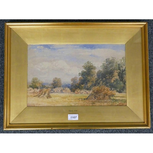 1107 - DAVID COX,  LANDSCAPE WITH CORN STOOKS,  SIGNED,  GILT FRAMED WATERCOLOUR 24 X 38 CM