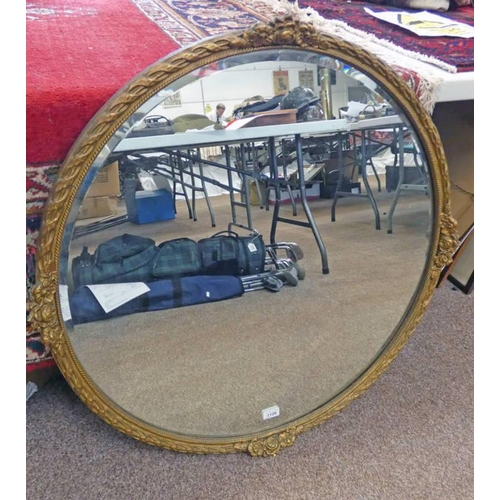 1126 - GILT FRAME CIRCULAR WALL MIRROR WITH CARVED FLORAL DECORATION - 87CM DIAMETER