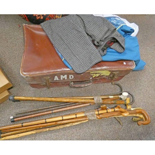 1149 - SELECTION OF WALKING STICKS, JACKET AND A SUITCASE