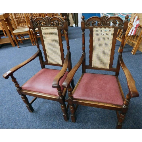 24 - PAIR OF LATE 19TH CENTURY OAK FRAMED OPEN ARMCHAIRS WITH DECORATIVE CARVING & BERGERE BACKS ON TURNE... 