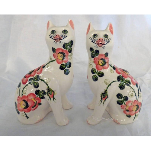 3177 - PAIR OF GRISELDA HILL POTTERY WEMYSS WARE CATS WITH FLORAL DECORATION. HEIGHT 17.5 CM