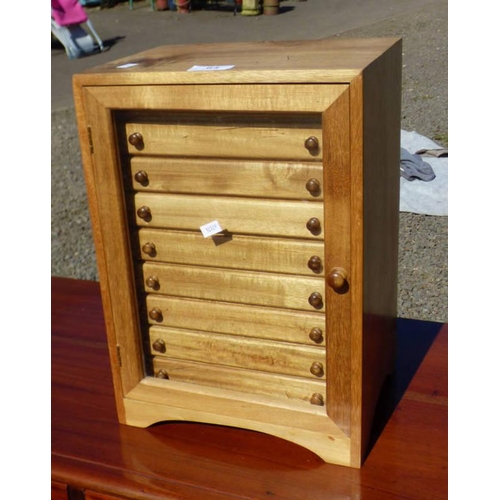 65 - HARDWOOD TABLE TOP FILING CHEST OF 11 DRAWERS BEHIND GLASS PANEL DOOR, WIDTH 27CM X HEIGHT 38CM