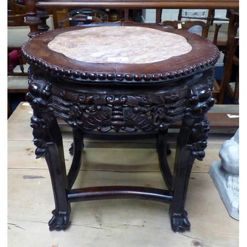 74 - CIRCULAR HARDWOOD CHINESE STAND WITH PINK GRANITE CENTRE ON CARVED SUPPORTS, HEIGHT 46CM