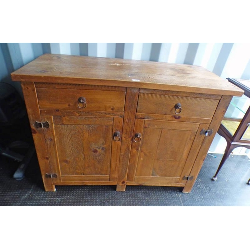 304 - RUSTIC PINE CABINET OF 2 DRAWERS OVER 2 PANEL DOORS ON SQUARE SUPPORTS. LENGTH 122 CM X HEIGHT 92 CM