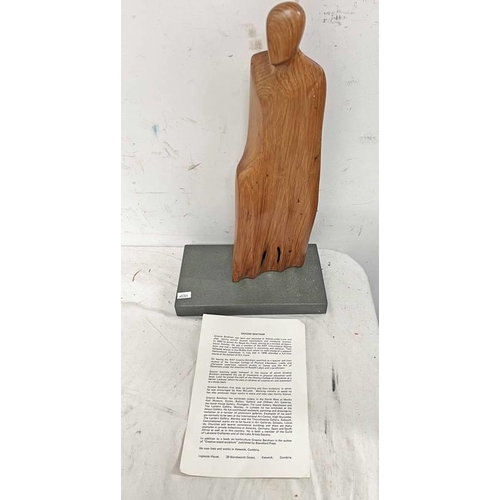 1489 - MAHOGANY FIGURE ON HARDSTONE BASE IN THE STYLE OF GRAEME BENTHAM WITH A GRAEME BENTHAM PAPER