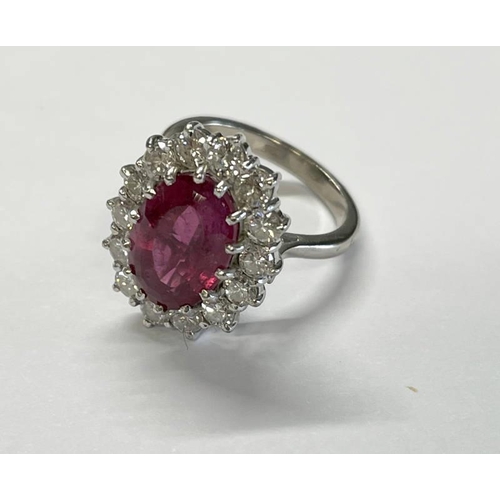 127 - 18CT GOLD PINK TOURMALINE & DIAMOND CLUSTER RING, THE OVAL TOURMALINE APPROX. 4.6 CARATS SET WITHIN ... 