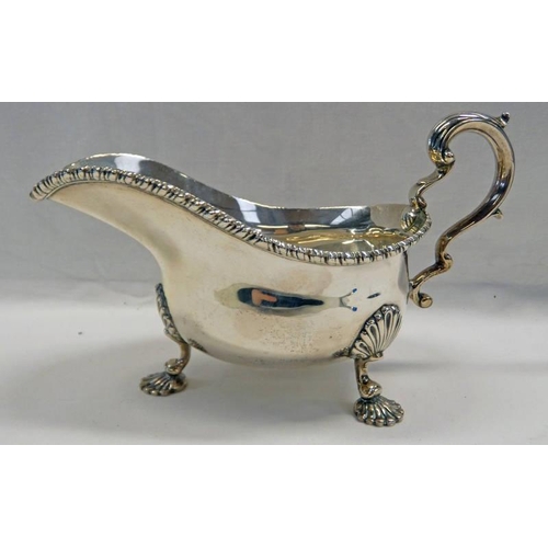 128 - SILVER SAUCE BOAT WITH DECORATIVE RIM & SHELL FEET, LONDON 1938 - 300G