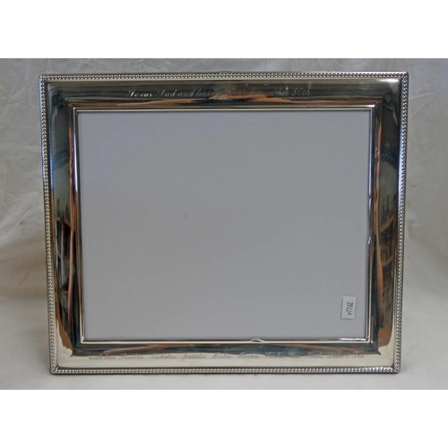 295 - SILVER PHOTO FRAME WITH DECORATIVE BORDER, SHEFFIELD 1983. WIDTH 32 CM