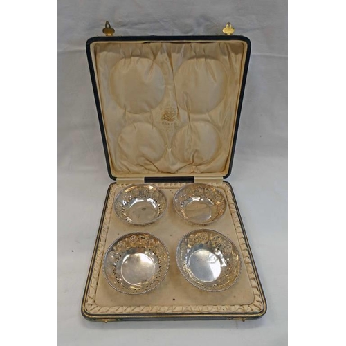 375 - CASED SET OF 4 SILVER CIRCULAR DISHES WITH PIERCED DECORATION, BIRMINGHAM 1921 RETAILED BY P. ORR & ... 