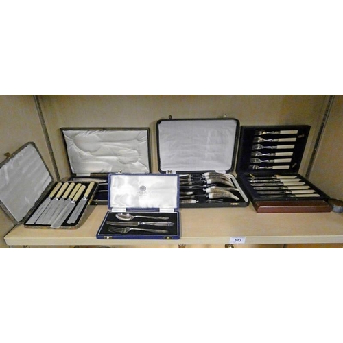 513 - CASED SET HORN HANDLED STEAK KNIVES & FORKS CASED SILVER PLATED SERVERS ETC ON ONE SHELF